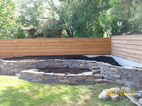 Another natural stone wall I built. I wasn't very particular about ...