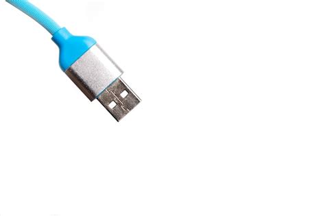 Premium Photo | Blue usb cable on white background.