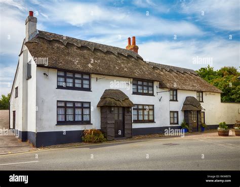 Beautiful thatched roof house in West Dorset. England Stock Photo - Alamy