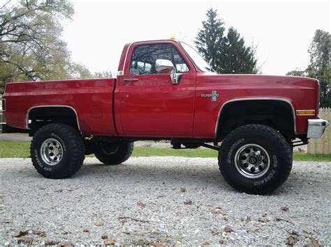 Red Lifted Chevrolet Chevy Truck | Jacked up trucks, Lifted chevy ...