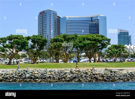 People stroll the waterfront areas near the San Diego Port and the ...