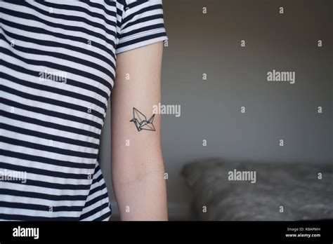 Origami crane tattoo Stock Photo - Alamy