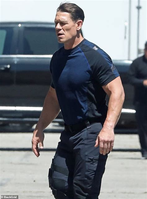 John Cena shows off muscles in clinging T-shirt as he and Scott ...