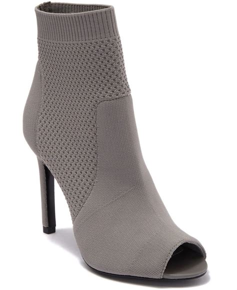 This stretch knit sock bootie features an on-trend peep toe and is ...