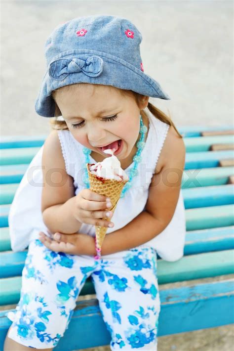 child eating ice cream cone | Stock image | Colourbox