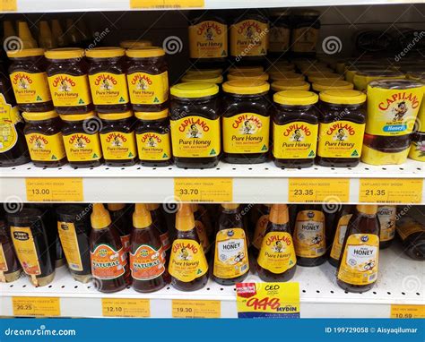 Pure Honey Packed in Plastic Bottles. Editorial Stock Photo - Image of ...