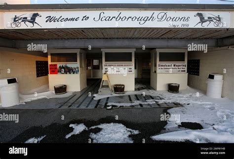 A sign welcomes race fans to the Scarborough Downs harness racing track ...