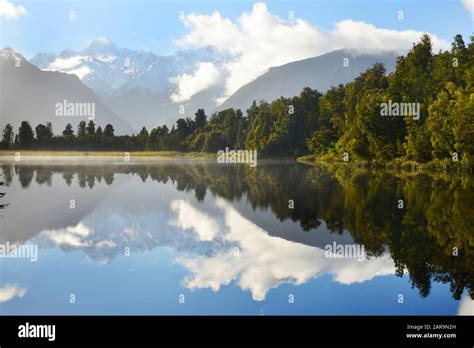 Reflection of Lake Matheson,South Island New Zealand Stock Photo - Alamy