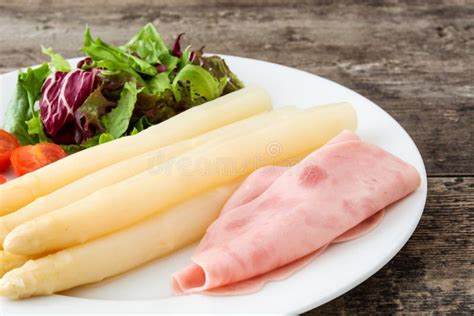 White Asparagus with Salad and Ham on Wood Stock Photo - Image of slices, tomato: 92248028