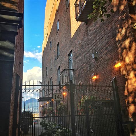 Free stock photo of alley, brick wall, cloud formation