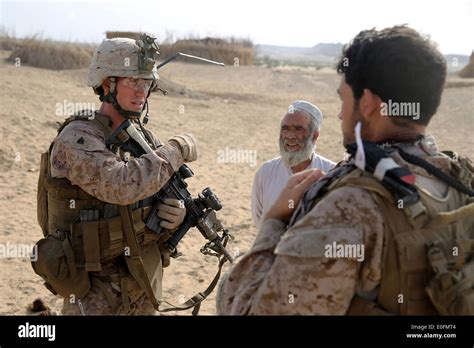 US Marine Sergeant Warren Sparks, squad leader with the Bravo Company assault force speaks with ...