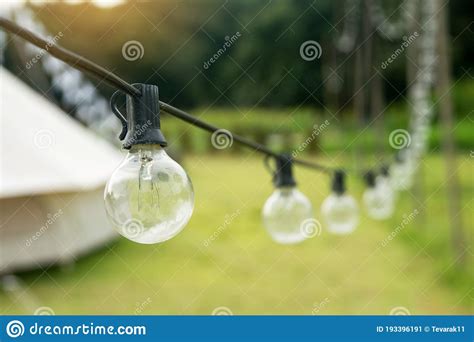 Outdoor String Light Bulbs Hanging on a Line Stock Image - Image of ...