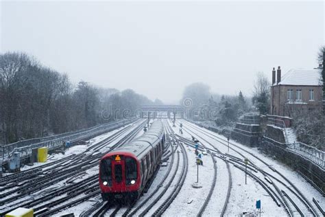 View of the Rails at Harrow on the Hill Station during a Snowy Winter ...