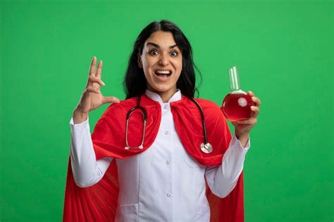 Free Photo | Excited young superhero girl wearing medical robe with ...