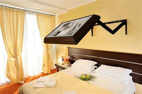 Mounted on the wall above your headboard these TV mounts extend your TV out over your bed to the ...