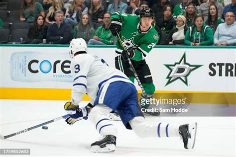 Roope Hintz of the Dallas Stars passes the puck past John Klingberg ...