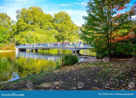 Tourists Crossing the Bridge Over the St James`s Park Lake in St James ...