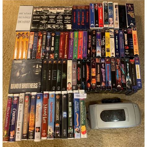 Massive VHS Movie Collection with VHS Tape Rewinder (Tested) - Beck Auctions Inc.