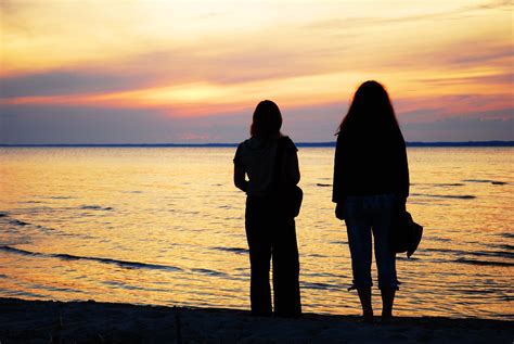 Two girls by the sea at the sunset Free Photo Download | FreeImages