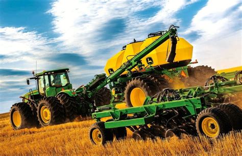 John Deere to buy Monsanto farm equipment business