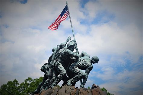 Black Statue of Man Holding Flag of America · Free Stock Photo