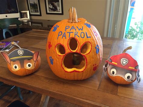 Paw Patrol pumpkins. Used Nick Jr. printed masks, and paint for eyes ...