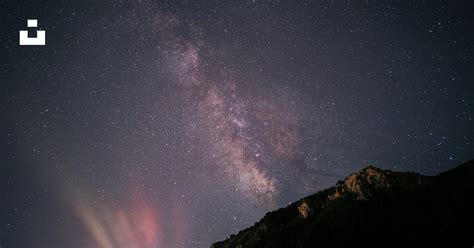 Black and white mountain under starry night photo – Free Grey Image on ...