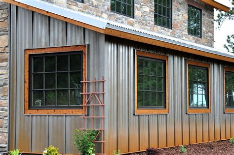 Close Up of Weathering Steel Ultra Batten Siding on barn | Metal siding house, House siding ...