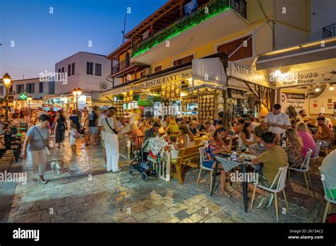 Busy street and nightlife in Skiathos Town, Skiathos Island, Sporades Islands, Greek Islands ...