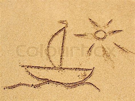 Simple sun drawing in the sand on the ... | Stock image | Colourbox