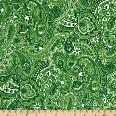 a green paisley print fabric on a ruler