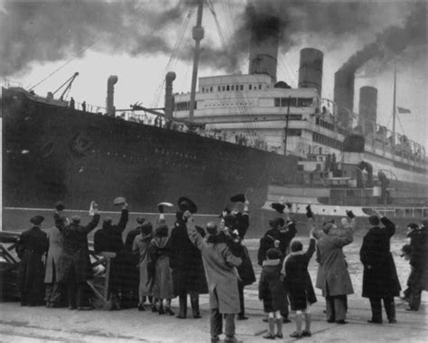 Aquitania is a mammoth next to the people waving to the passengers. Next stop...NEW YORK ...