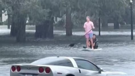 Hurricane Ian: Orlando residents paddle board through flooded streets ...