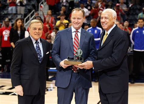 Head coach Mike Budenholzer of the Atlanta Hawks accepts the 2014-15 ...