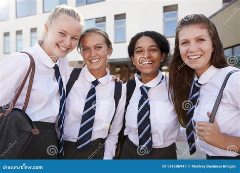 Portrait of Smiling Female High School Students Wearing Uniform Outside College Building Stock ...