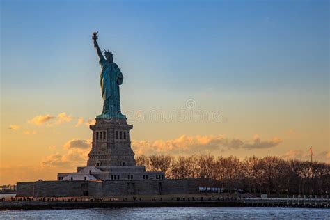 Statue of liberty sunset. stock image. Image of landmark - 83725307