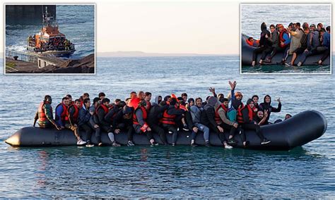 Migrants give thumbs up from small boats crossing the Channel - as it ...