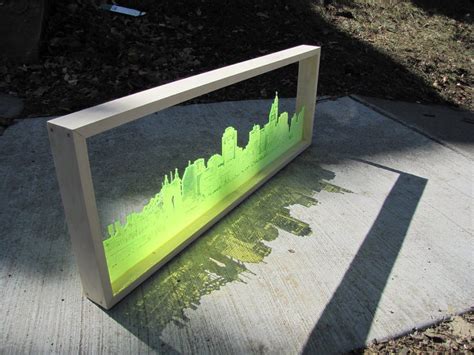 Lasercut city makes a night and day skyline Laser Cutter Ideas, Laser Cutter Projects, Laser ...