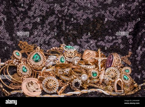 pile of gold on black background Stock Photo - Alamy