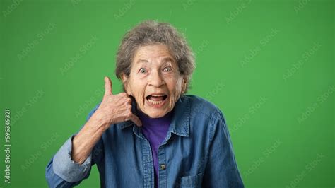 Portrait of smiling happy elderly senior old woman with wrinkled skin ...