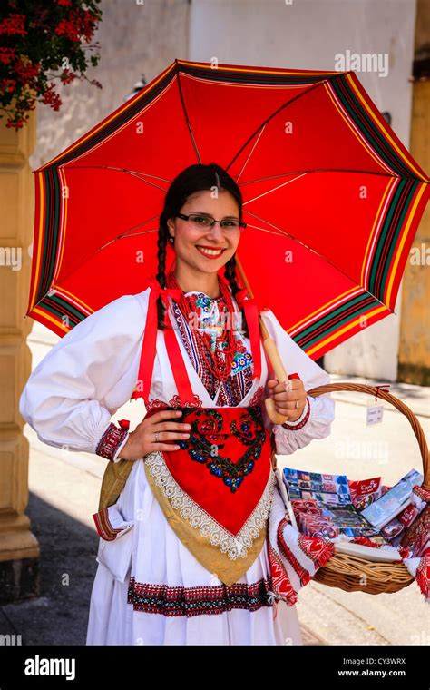 Croatian girl dressed in traditional clothing sells souvenirs in Zagreb ...