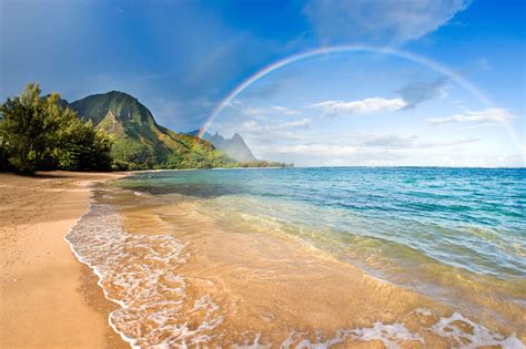 rainbow paradise beach paradise rainbow over tunnels beach on the north shore of Kauai. Hawaiian ...