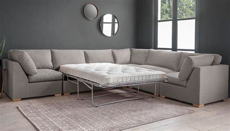 Create your perfect space with this large modular corner sofa bed. The two seater unit opens ...