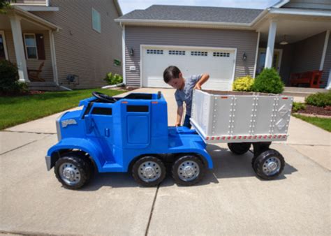 This rideable toy semi truck has a 'CB' and a detachable trailer and ...