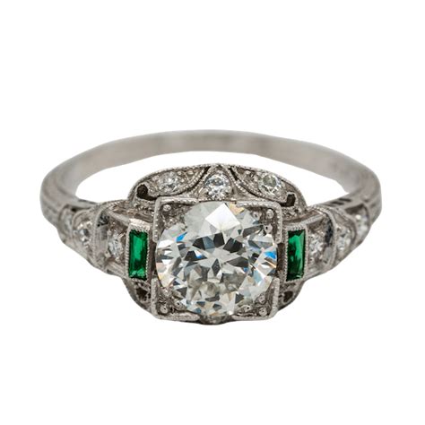 Art Deco diamond and emerald shoulders cluster ring