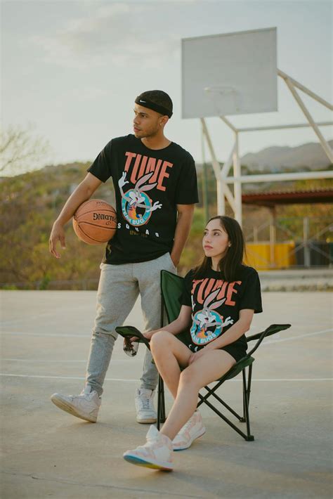 Couple in Matching T-shirts on a Basketball Court · Free Stock Photo