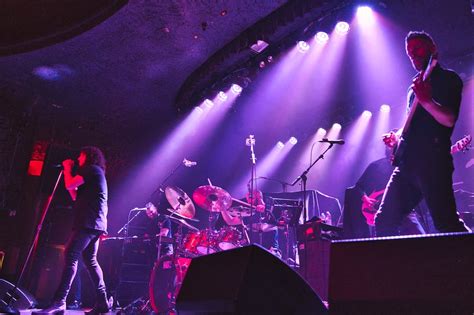 A group of people on stage playing instruments photo – Free Haken Image on Unsplash