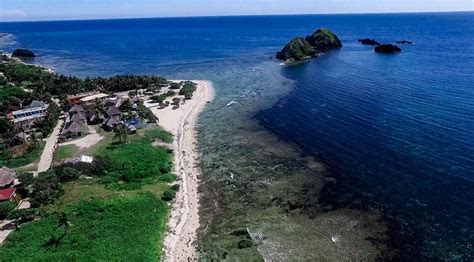 This the Blue Lagoon Beach in Pagudpud, Ilocos Norte, in the Philippines. In the back to the ...