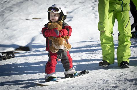 Baby Xander, age 2 yrs, snowboarding for the first time. Dont forget ...