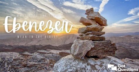 rocks stacked on top of each other with the sun setting in the background